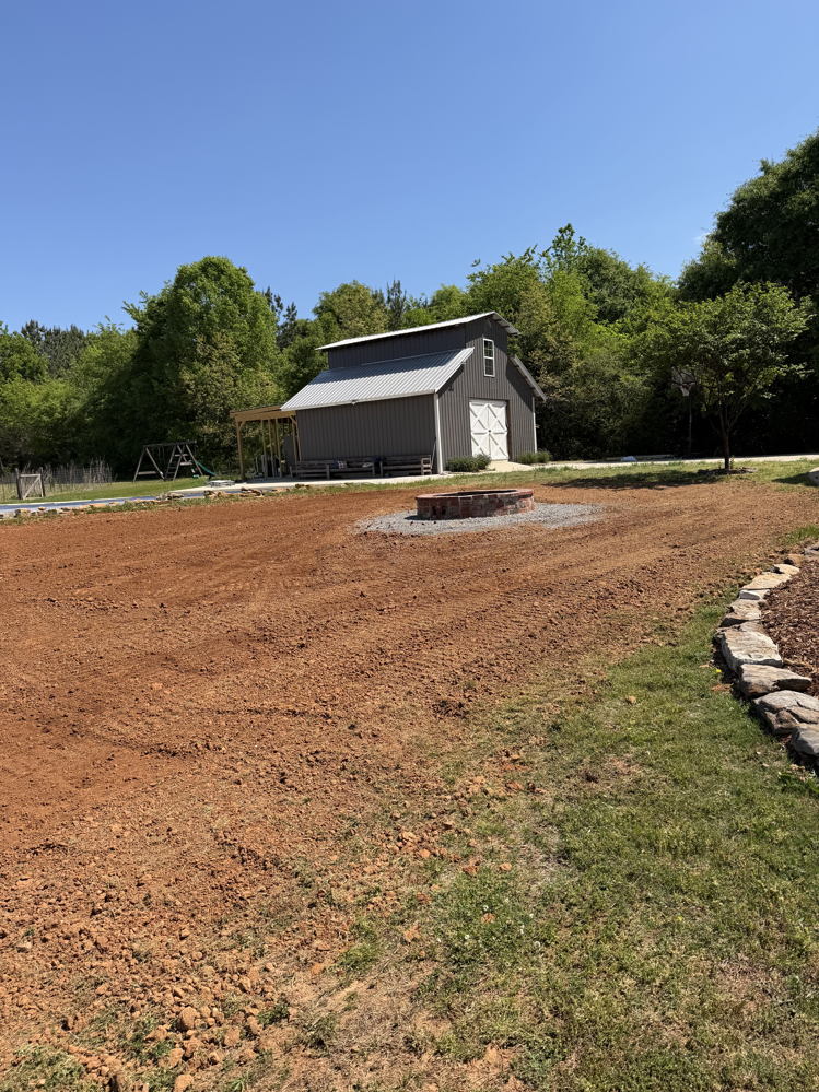March 2026 land leveling and fire pit project - photo 4